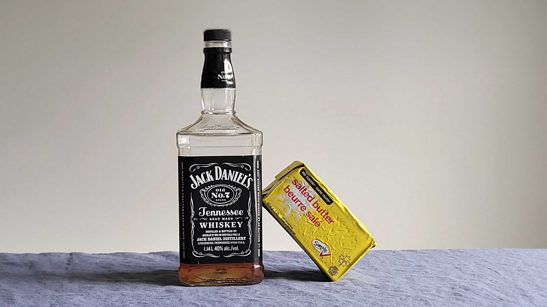 Bottle of Jack Daniel's Tennessee whiskey with butter.