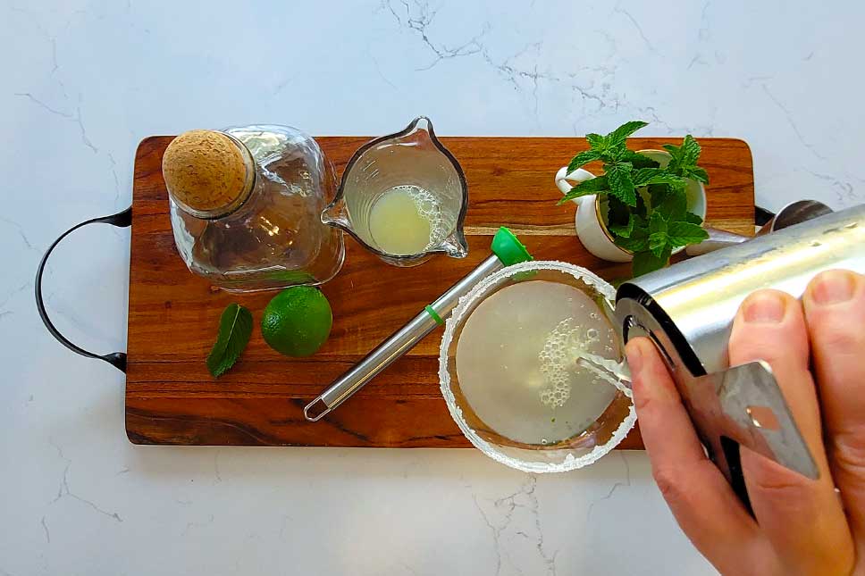 Pouring a Mojarita Cocktail.