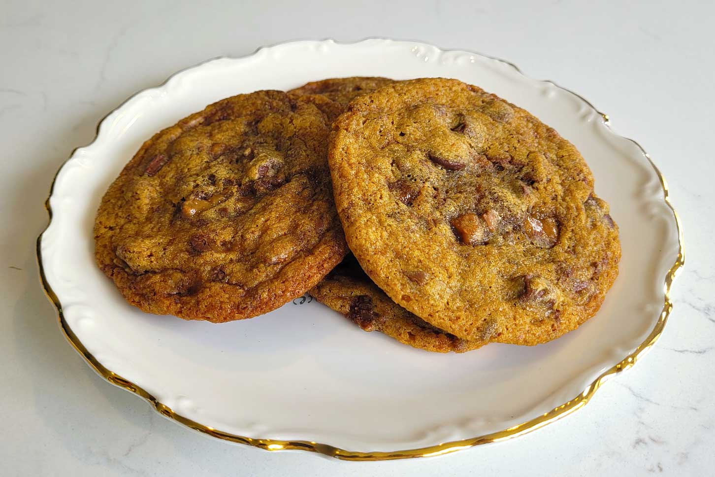 Brown Butter Bourbon Toffee Chocolate Chip Cookies on a plate.