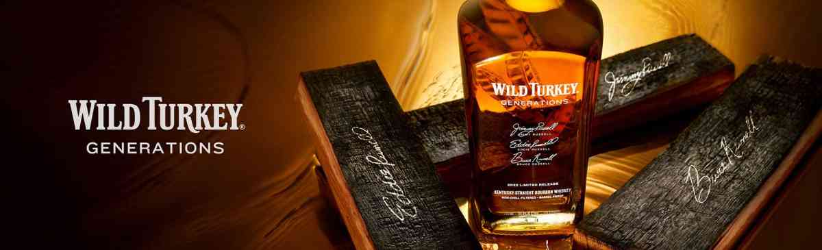 A bottle of Wild Turkey Generations whiskey with signed barrell staves.