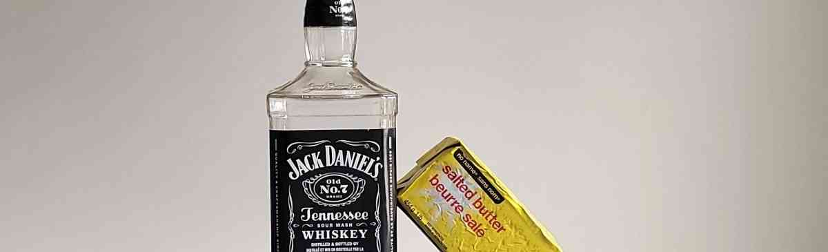 Bottle of Jack Daniel's Tennessee whiskey with butter.