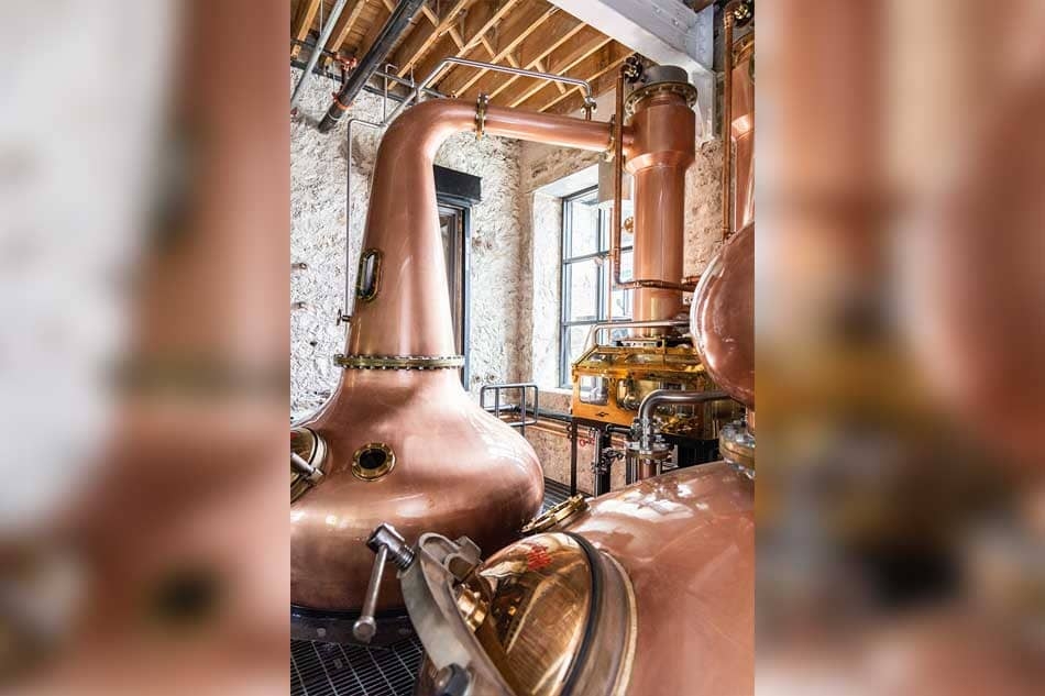 Copper pot stills inside Spring Mill Distillery.