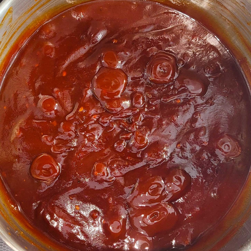 Pot of simmering Bourbon BBQ Sauce.