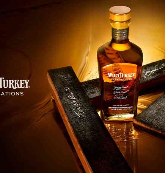 A bottle of Wild Turkey Generations whiskey with signed barrell staves.