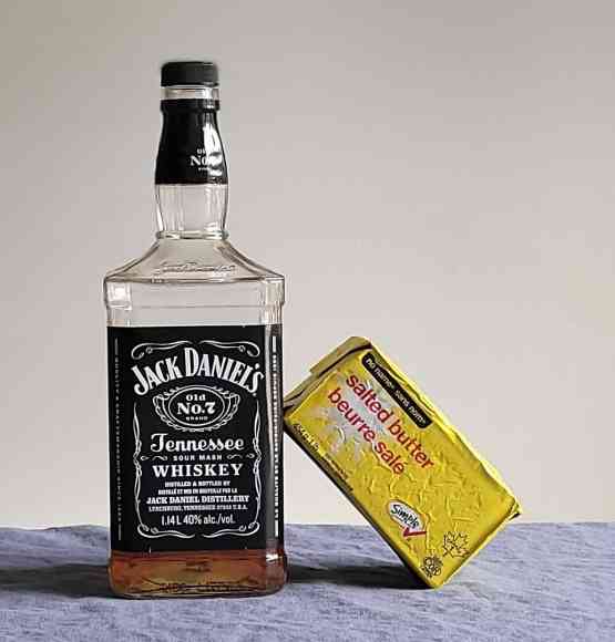 Bottle of Jack Daniel's Tennessee whiskey with butter.