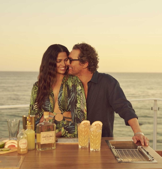 Matthew and Camila McConaughey with Pantalones Premium Tequila abord a cruise ship.