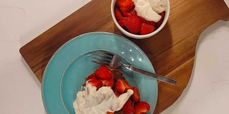 Plate of fresh strawberries with Bourbon Whipped Cream.