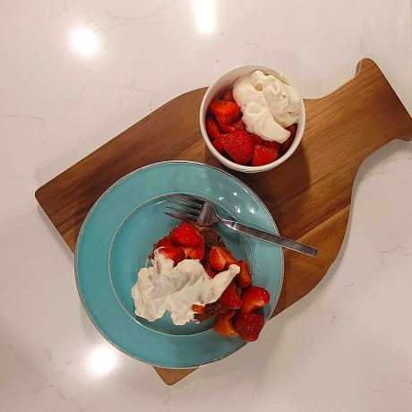 Plate of fresh strawberries with Bourbon Whipped Cream.