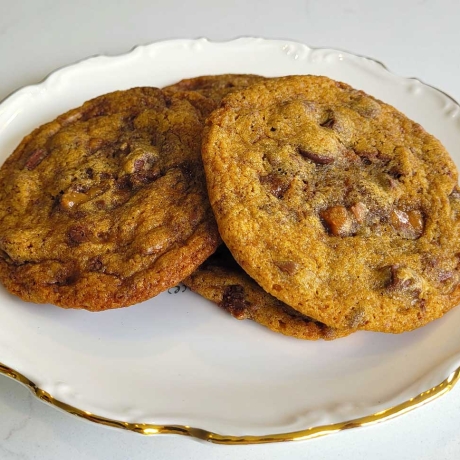 Brown Butter Bourbon Toffee Chocolate Chip Cookies on a plate.