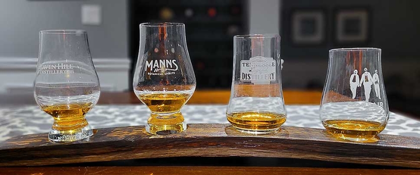 Whisky tasting flight board with glasses.