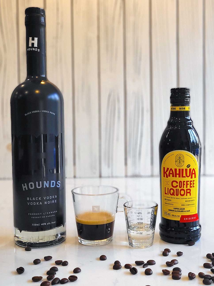 Espresso martini ingredients including vodka, espresso, simple syrup and Kahlúa .